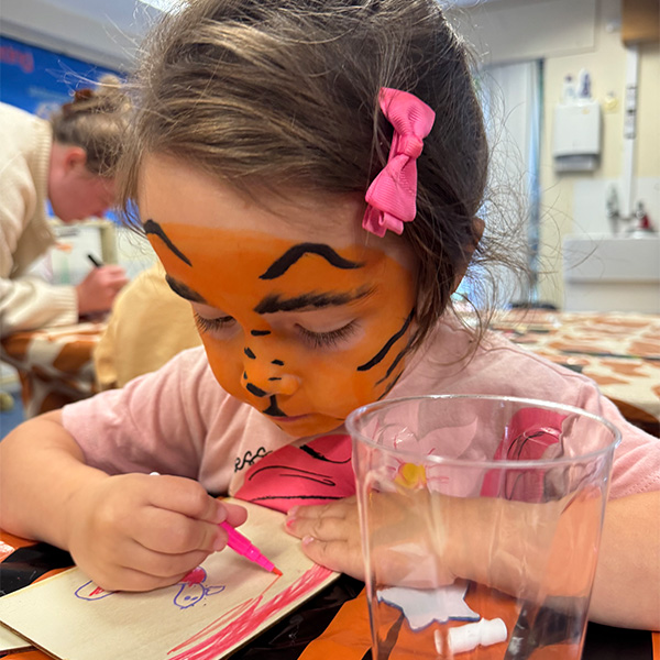 A girl doing craft activity in a library
