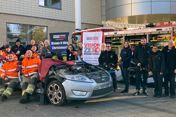 SY Fire and Rescue team at a staged crash scene for road safety awareness.