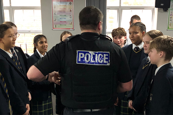 Police officer talking with children at Making South Yorkshire Roads Safer Campaign