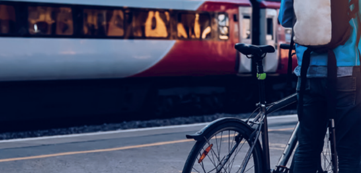 Cyclist at a rail platform
