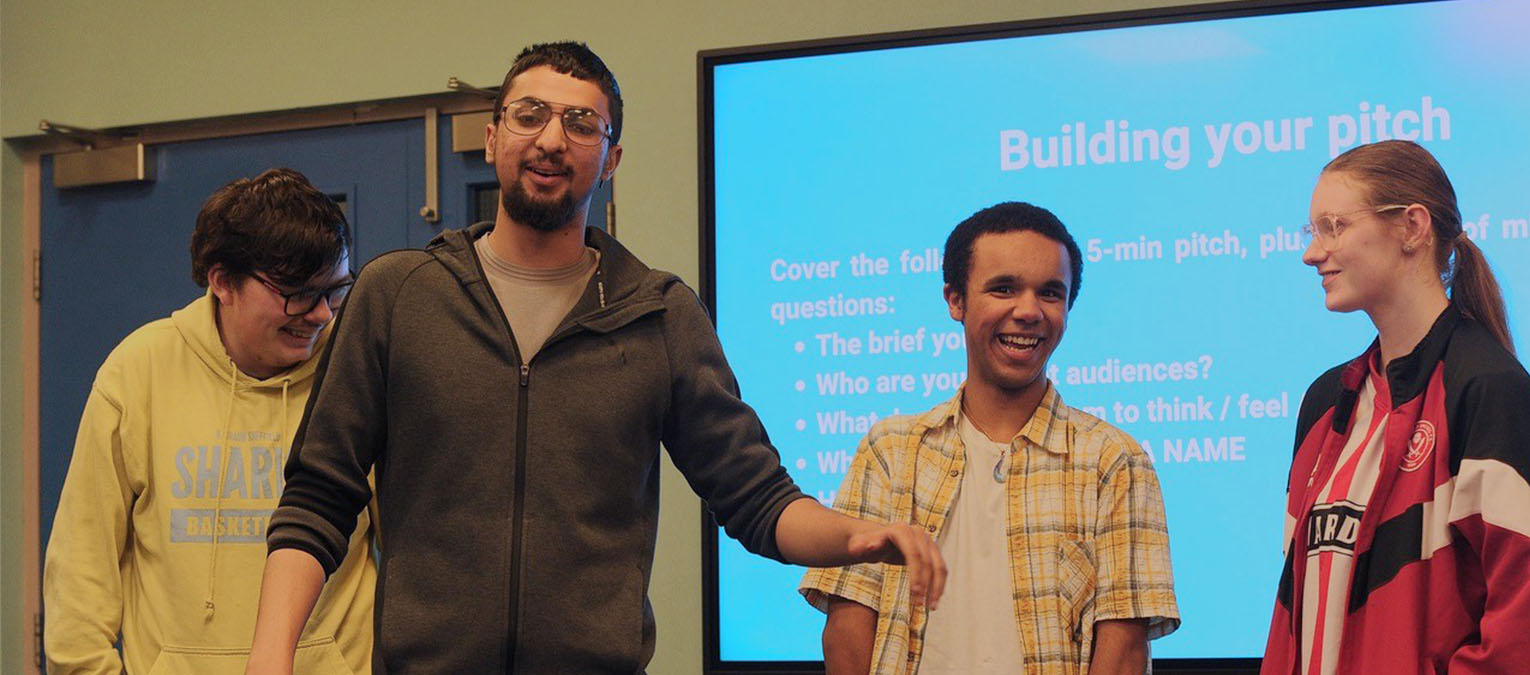 Group of young people doing presentation at careers talk session