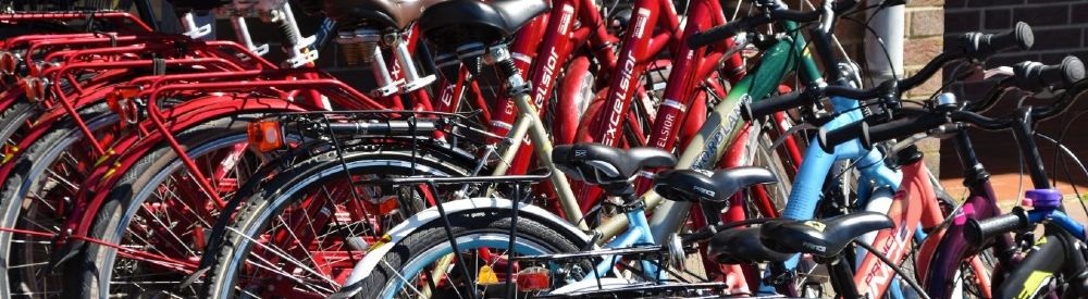 Bicycles stacked up next to each other