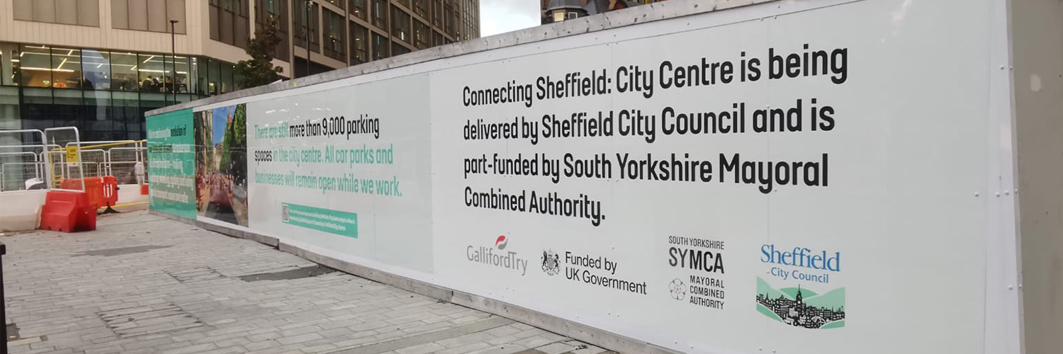 Construction site hoarding promoting the Connecting Sheffield City Centre project and funding partners.