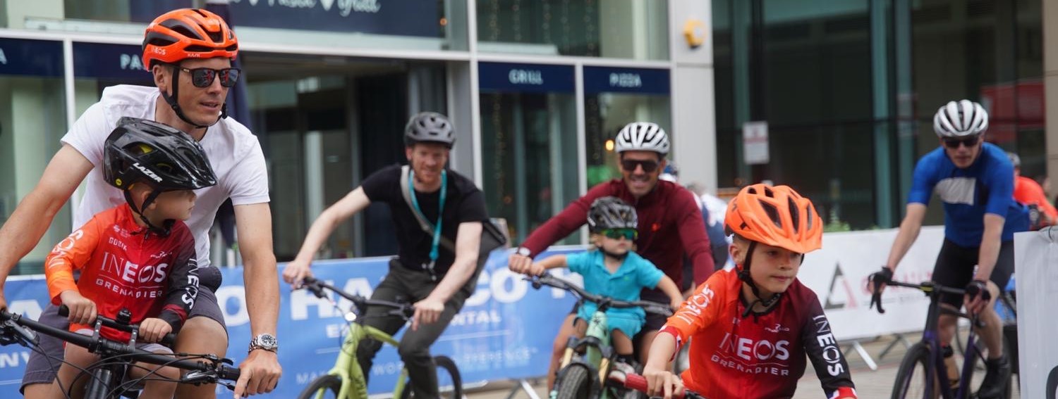 Adults and children cycling