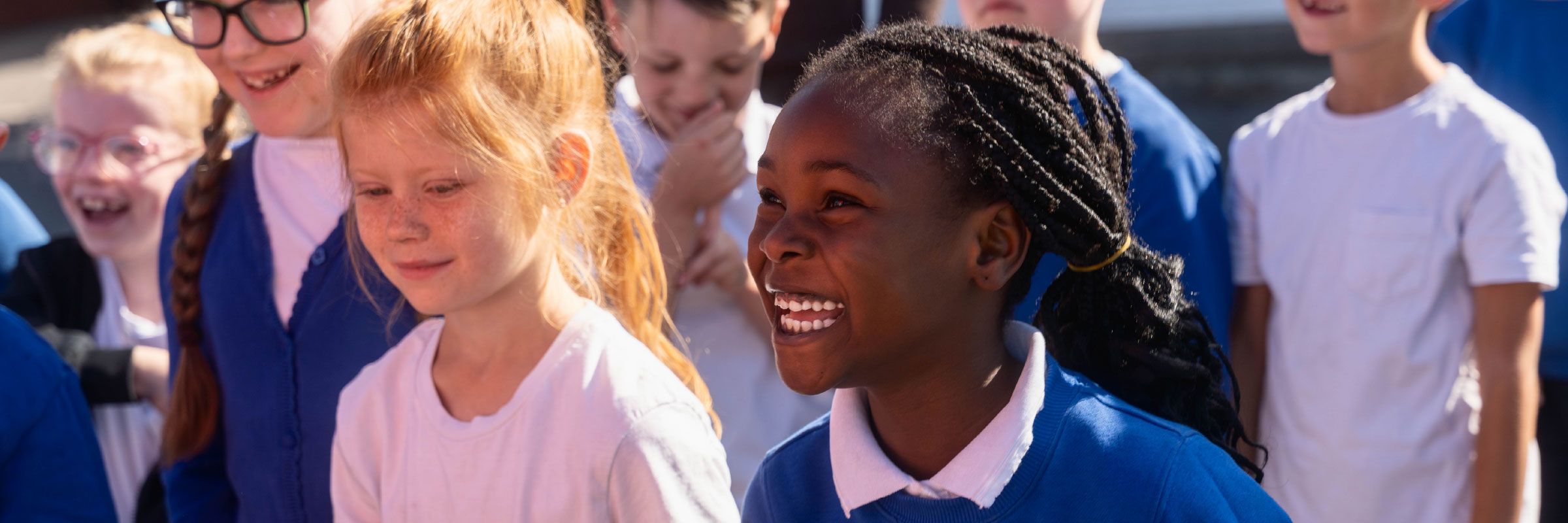 A couple of children smiling