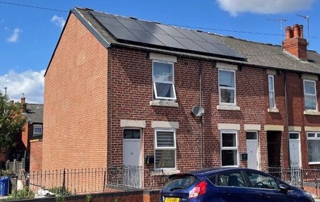 Picture in front of the Let Zero Show Home